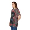 Red flowers, green leaves, and geometric patterns cover this all over print apparel, featuring a black cat with striking green eyes.