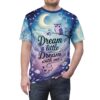 Deep blues and purples with hints of yellow and white cover this seamless pattern tee, depicting a whimsical night sky with a crescent moon, stars, clouds, and a purple owl perched on a branch.