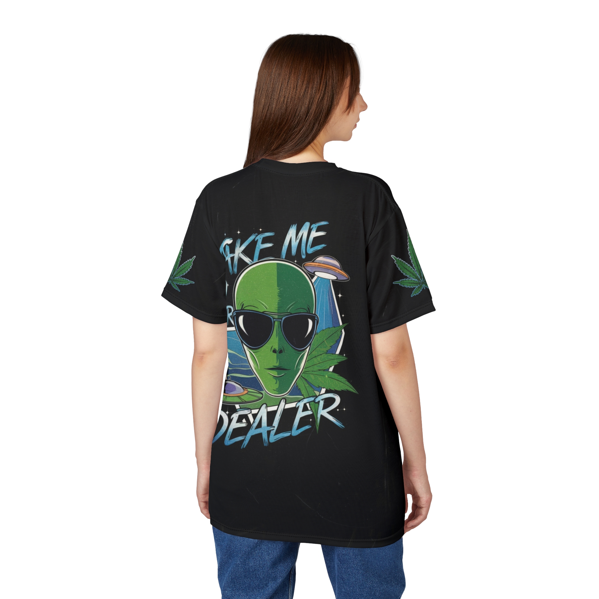 Green and blue graphics, including pot leaves, aliens, and UFOs, cover this black t-shirt.