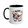 White ceramic mug with a black interior and handle, featuring a cute sloth in a pink hammock with the words 