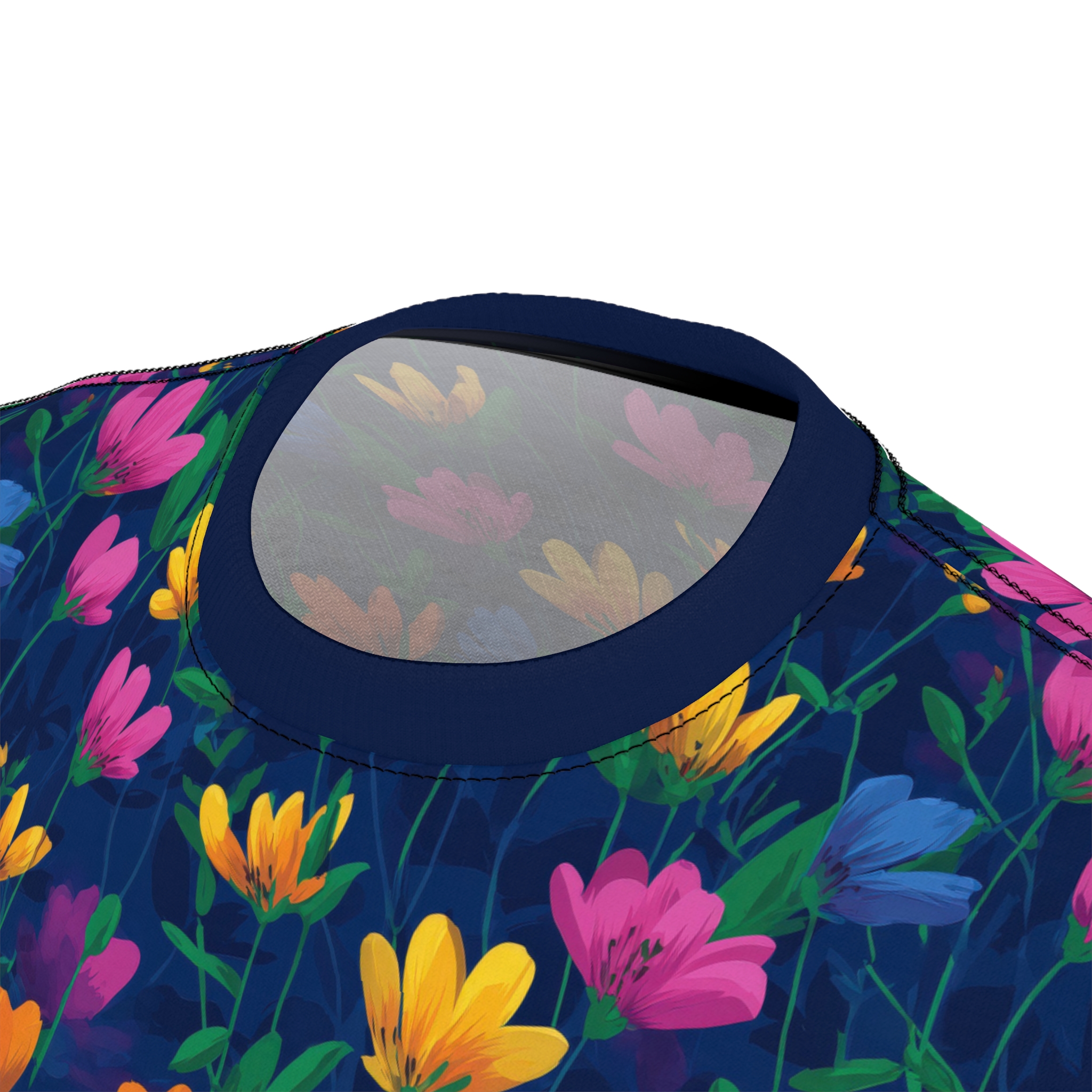 Bright pink, yellow, and blue flowers with green leaves scatter across this dark navy graphic streetwear tee, depicting a vibrant garden scene.