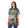 Vibrant blues, pinks, and yellows cover this sublimation graphic tee, featuring a regal hedgehog wearing a golden crown amidst a field of colorful flowers.