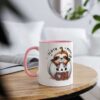 White ceramic mug with a pink handle, featuring a cute sloth peeking out of a pumpkin.