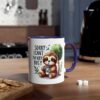 White ceramic mug with a purple handle, featuring a cartoon sloth drinking coffee and the text 