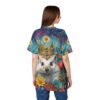 A regal hedgehog wearing a jeweled crown, surrounded by vibrant flowers and a dreamy cosmic background, covers this patterned tee shirt.