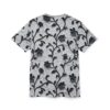 Black floral vines and textured petals cover this sublimation graphic tee, with a textured background.