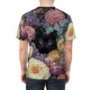 Purple, pink, white, and yellow flowers, along with a black cat with orange eyes, cover this all over print t-shirt.