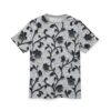 Textured black floral vines and blooms cover this seamless pattern tee, on a raised white stucco-like background.