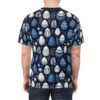 Blue and white Easter eggs with floral and geometric patterns cover this all over print t-shirt, with delicate white leaves and flowers scattered throughout on a dark navy background.