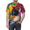 Vibrant yellows, pinks, and purples form a lush floral arrangement, framing a black cat with striking green eyes on this graphic t-shirt.
