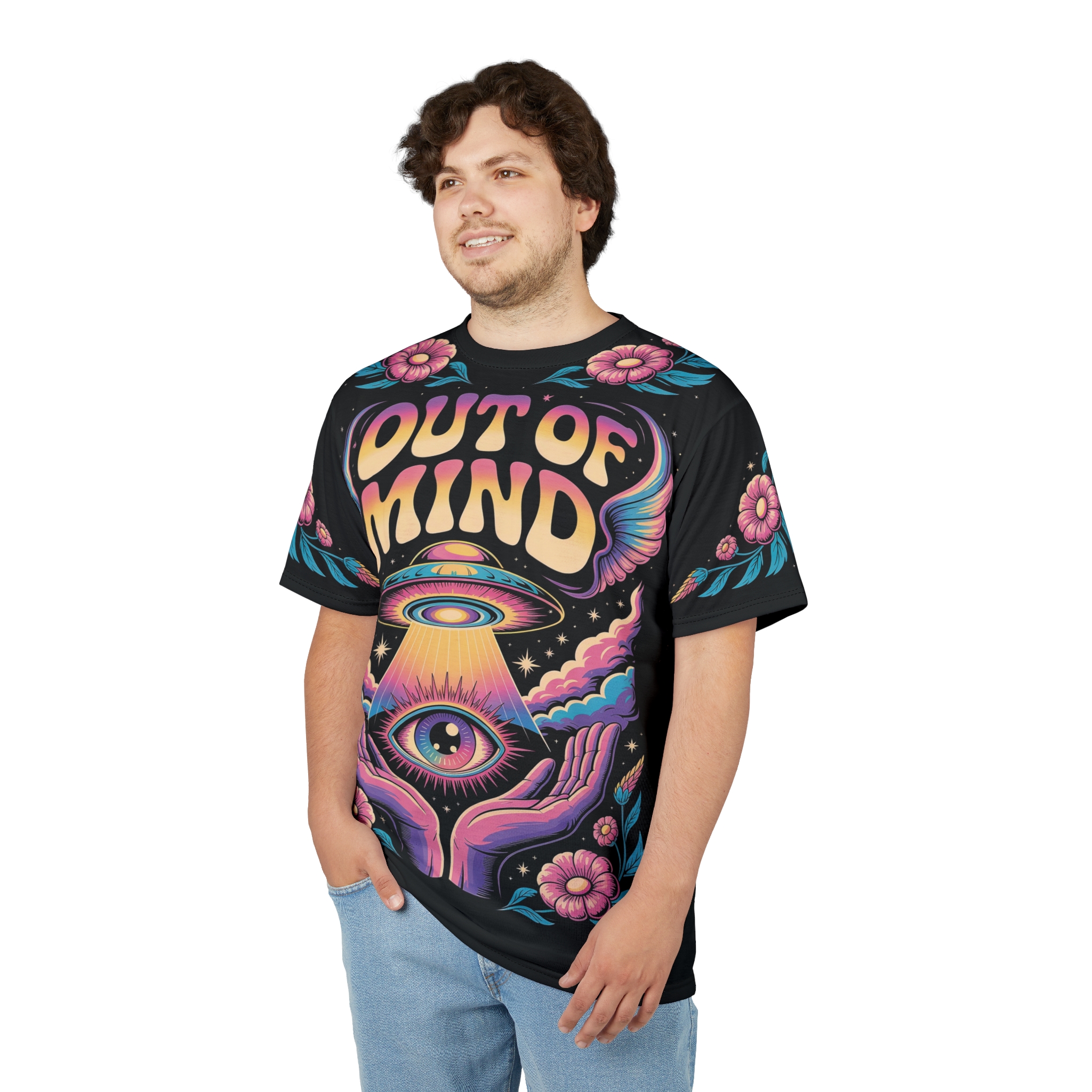 Vibrant pink flowers, cosmic clouds, a UFO, and an eye held by hands cover this all over print apparel, with the text 'OUT OF MIND' in retro lettering.