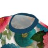 Red, teal, and green flowers with textured petals and yellow centers cover this oversized full print tee, with muted green leaves scattered throughout.