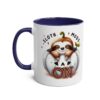 White ceramic mug with a navy blue handle and interior. Features a cute sloth peeking out of a white pumpkin with 