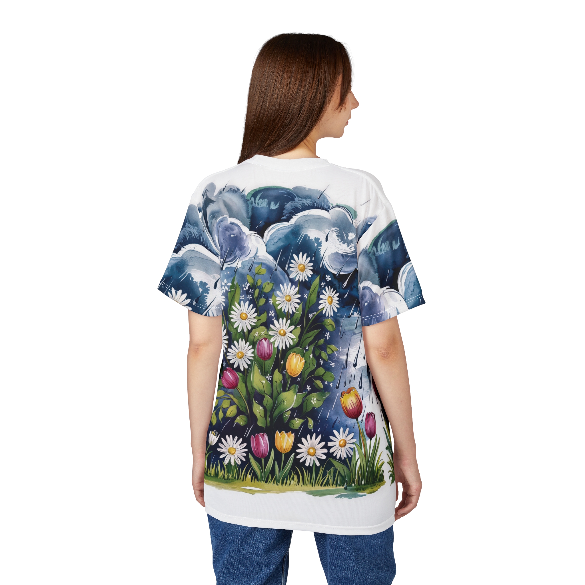 Dark blue stormy clouds with rain showers and a lush floral garden of daisies and tulips cover this oversized full print tee.