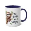 White ceramic mug with a navy blue handle and interior, featuring a cartoon sloth on a branch with the text