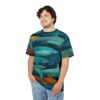 Teal and orange sharks swim in deep blue water across this patterned tee shirt.