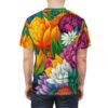 Vibrant yellows, oranges, pinks, purples, and whites in lush floral patterns cover this full print shirt, depicting a dense garden of blooming flowers and green leaves.