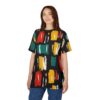 Red, teal, yellow, white, and orange brushstrokes cover this sublimation graphic tee, creating a bold abstract design on a black background.