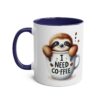 White mug with a dark blue handle and rim, featuring a cute sloth peeking out of a coffee cup that says 
