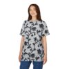 Textured light grey fabric with raised black floral vines and flowers cover this sublimation graphic tee.