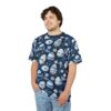 Blue and white patterned Easter eggs and small white flowers cover this graphic streetwear tee, set against a dark blue background with leafy foliage.