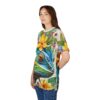 Vibrant blues, greens, yellows, and purples cover this seamless pattern tee, featuring a detailed chameleon and lush tropical flowers.
