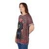 Red floral patterns and a black cat with a cube head cover this all over print apparel, with eyes scattered throughout.