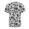 Black floral vines and textured white background cover this seamless pattern tee, creating a striking contrast.