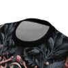 Dark grey and pink botanical elements and an eye cover this full print shirt, featuring a gothic all-over design.