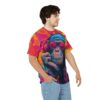 Vibrant pink, orange, and blue paint splatters cover this all over print apparel, depicting a cool chimpanzee wearing headphones and sunglasses.