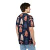 Brown, white, and blue bears holding pink and blue umbrellas are scattered across this dark blue t-shirt with a rain pattern.