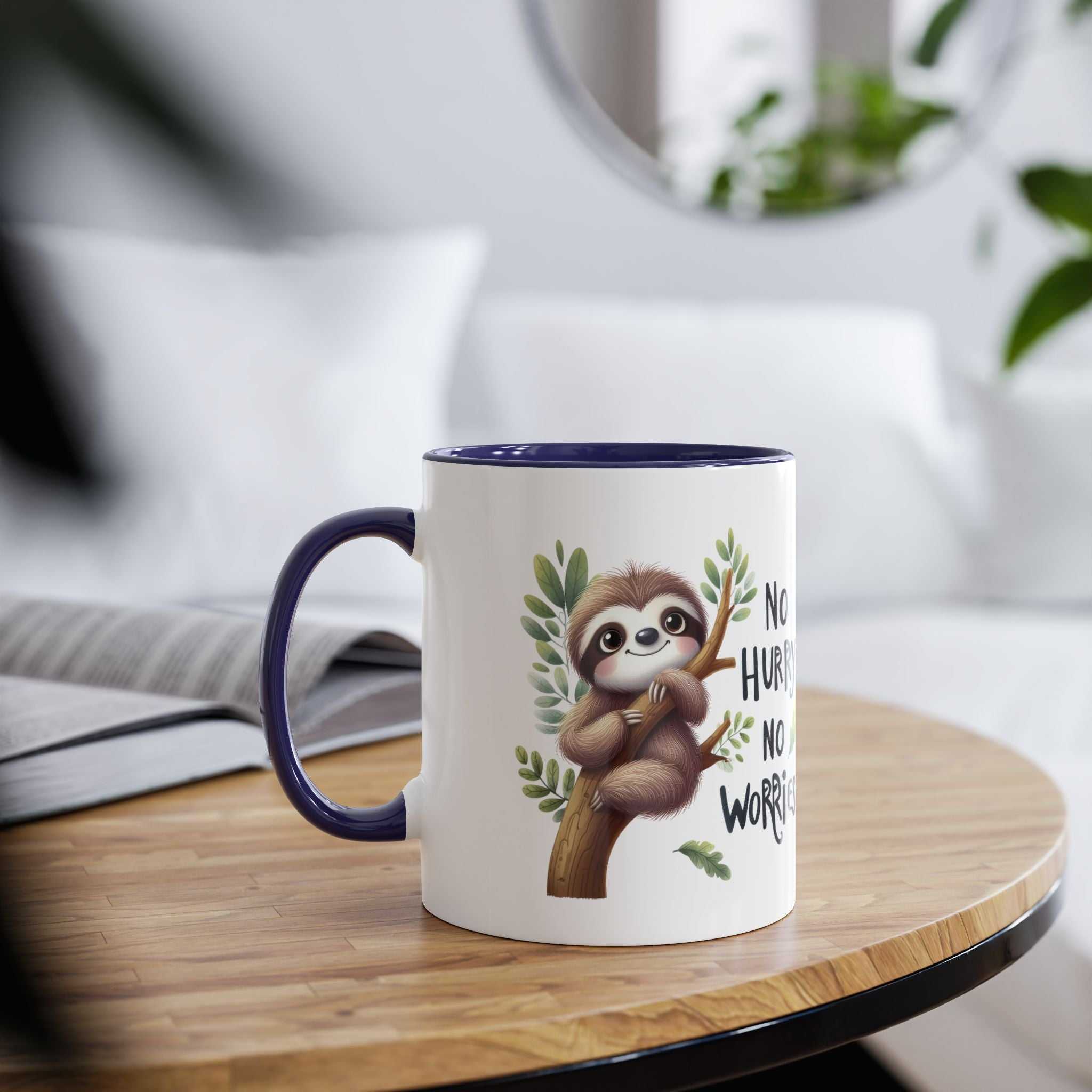 A white ceramic mug with a dark blue rim and handle, featuring a cute sloth illustration on a branch with text.