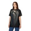 Dark celestial figures and feathered wings are printed across this graphic tee, set against a starry night sky with a glowing moon.