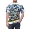 Dark blue and green watercolor clouds and rain streaks cover this graphic streetwear tee, with white script reading 'April Showers Bring May Flowers' and a floral border.