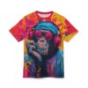 Splashes of pink, yellow, and blue paint cover this all over print apparel, featuring a cool chimpanzee in headphones and sunglasses.