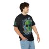 Green aliens, flying saucers, and cannabis leaves cover this black tee, with text reading