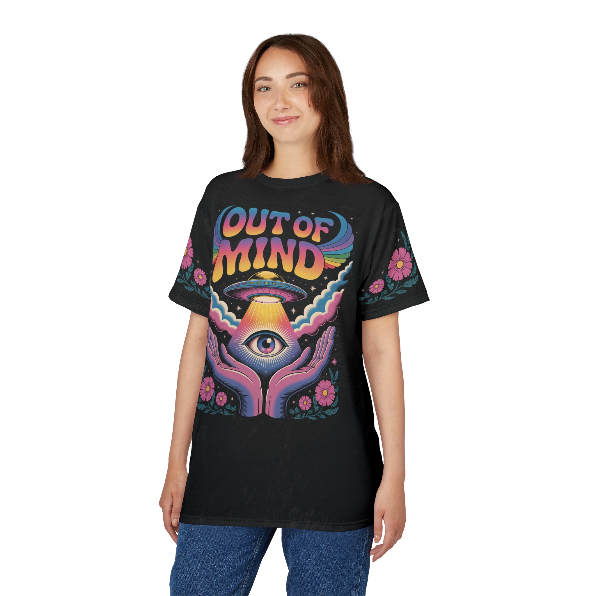 Vibrant rainbow text and pink flowers surround a trippy eye and UFO design on this black graphic tee.