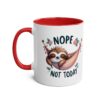 White ceramic mug with a red interior and handle, featuring a sleeping sloth in a hammock with 