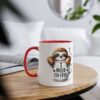White mug with red interior and handle, featuring a cartoon sloth inside a coffee cup saying 