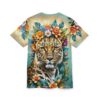 Vibrant orange and blue flowers, lush green leaves, and a detailed leopard face cover this oversized full print tee, set against a soft beige and teal background.