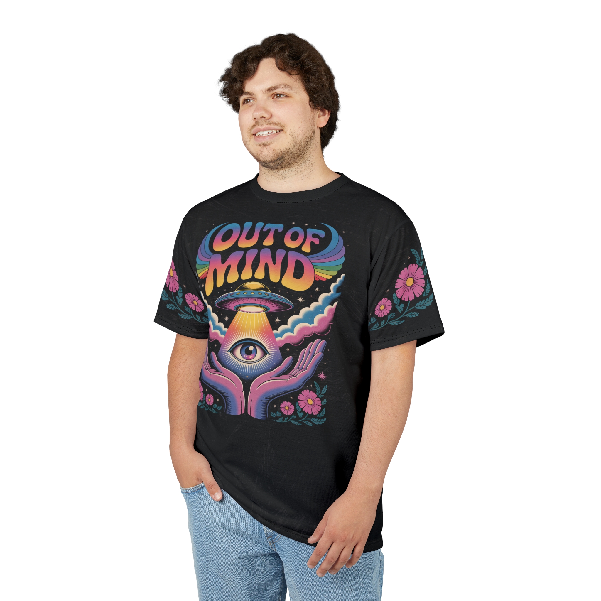 Pink flowers and teal leaves adorn the sleeves, while the front features a psychedelic eye and UFO design with rainbow lettering.