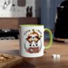 White ceramic mug with a green interior and handle, featuring a cute sloth peeking out of a pumpkin.