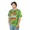 Green shamrocks cover this graphic streetwear tee, with text that reads 