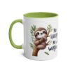 White ceramic mug with a green handle and interior, featuring a cute sloth illustration and the words