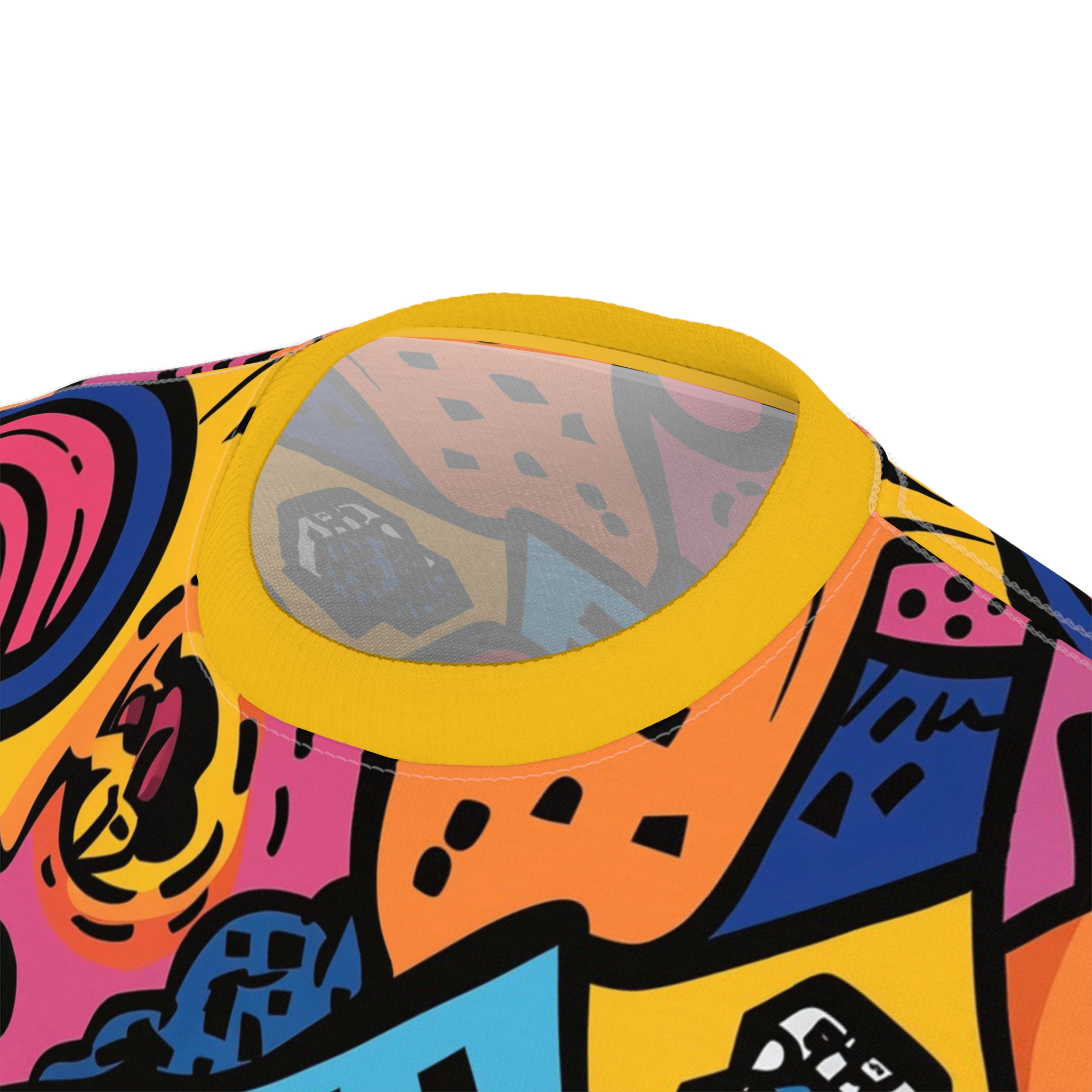 Bold abstract shapes in pink, blue, orange, and yellow cover this patterned tee shirt, with black outlines creating a graphic, energetic feel.