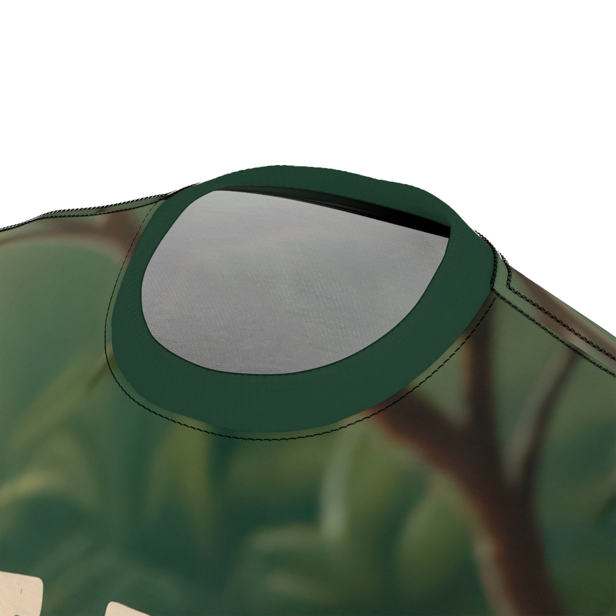 Green and brown tones with blurred branches cover this patterned tee shirt, depicting a serene jungle backdrop.