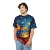 Deep blues and starry yellows cover this patterned tee shirt, depicting a blue chihuahua surrounded by flames on a cosmic background.