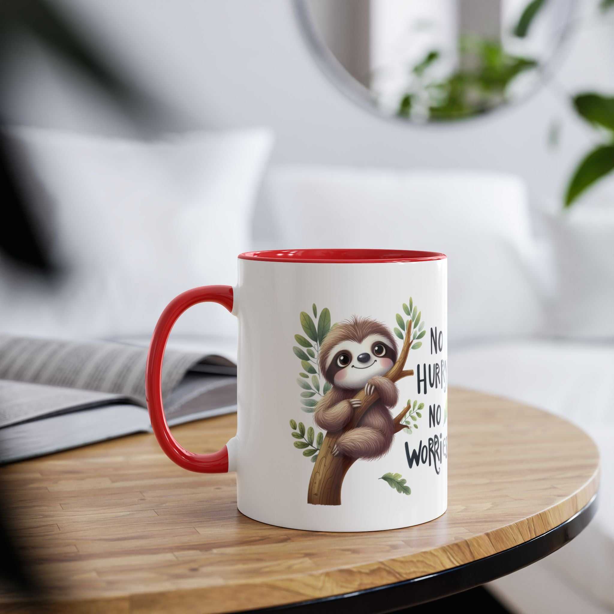 White ceramic mug with a red handle and rim, featuring a cute sloth illustration on a branch with text.