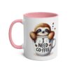 White ceramic mug with a pink handle and interior, featuring a watercolor-style sloth peeking out of a coffee cup that says 