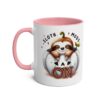 A white ceramic mug with a pink handle and interior, featuring a cute cartoon sloth peeking out of a pumpkin with 